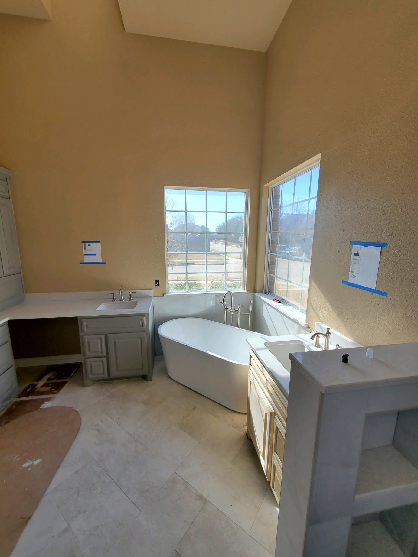 Bathroom remodel with a custom corner tub and cabinetry
