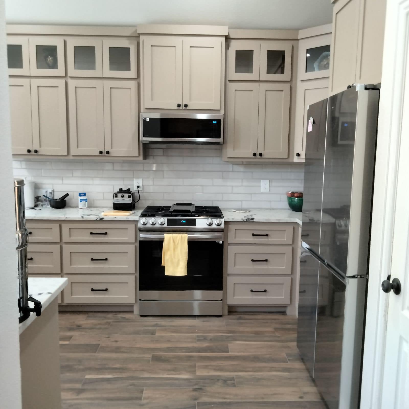 Kitchen remodel with new cabinetry, countertops and lighting