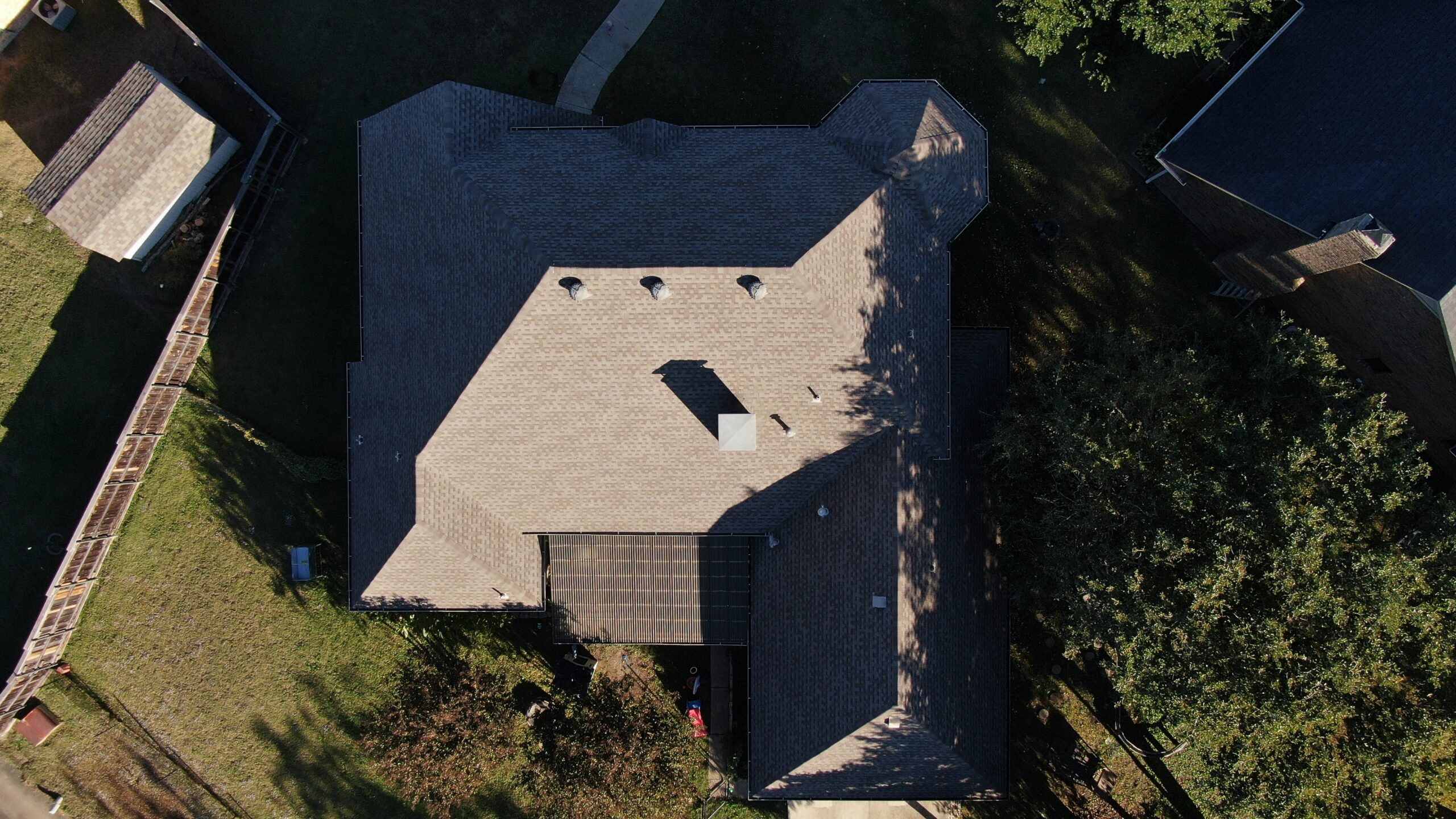 Aerial drone view of a completed residential roof replacement by Concord Roofing & Construction